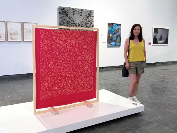 Rozana Lee with 2021 NCAA Peoples Choice Award artwork